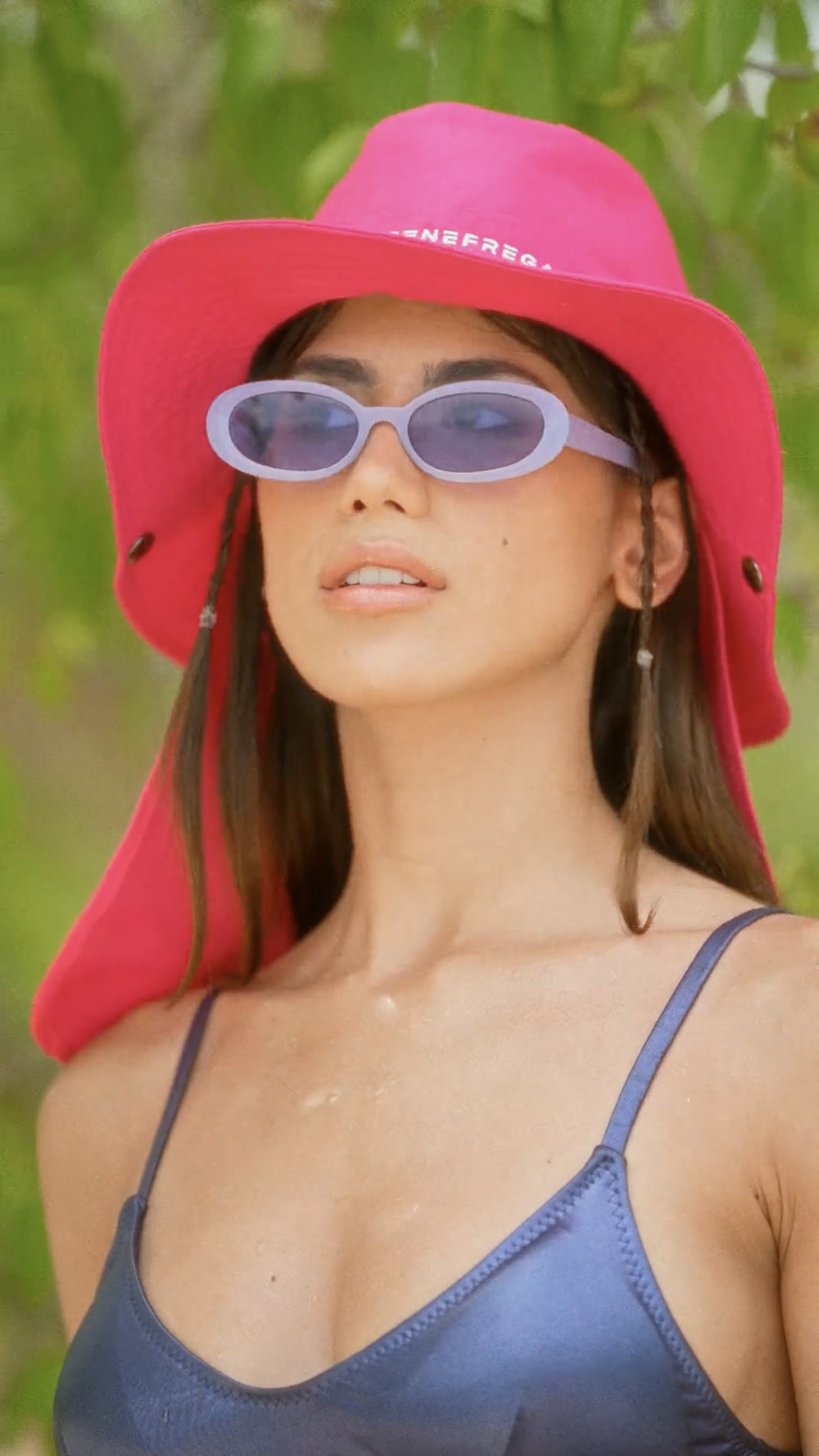 Frame with vibrant color: pink beanie and natural light