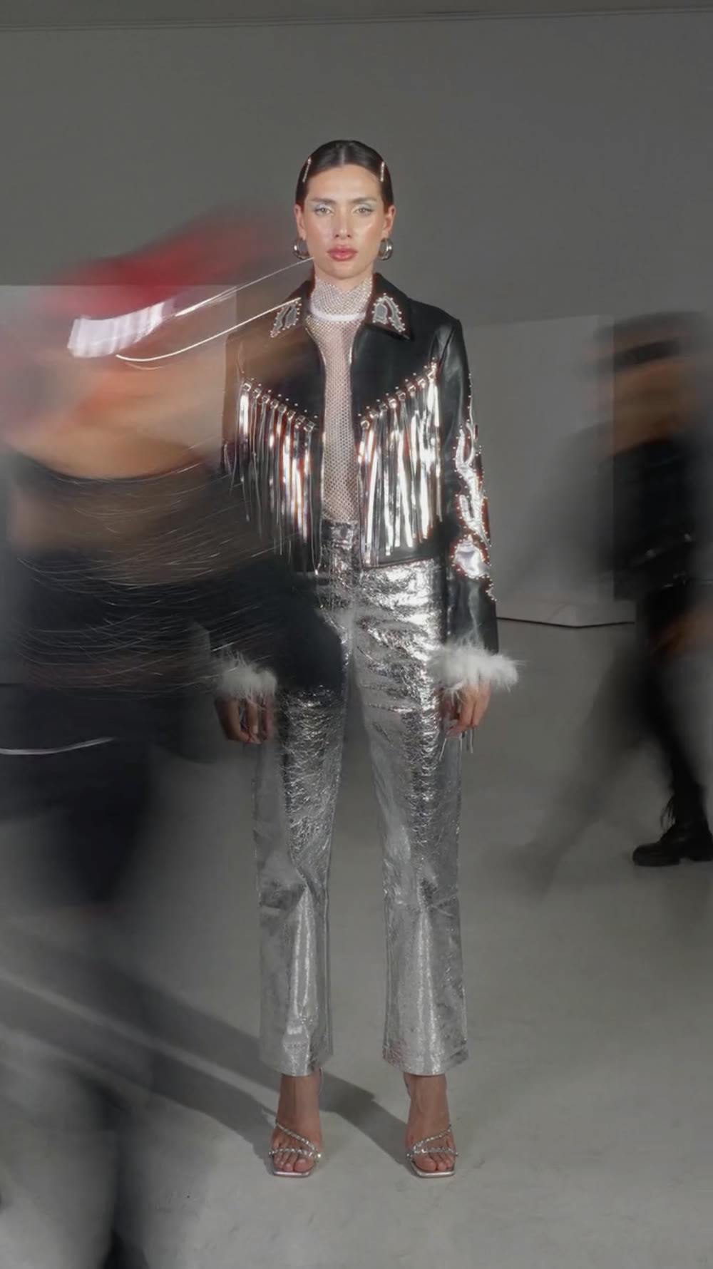 Fashion still: metallic silver look in the studio